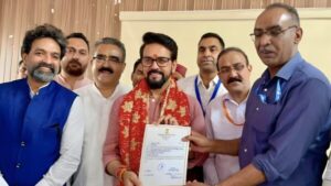 Anurag Thakur receiving the certificate of victory for the fifth time.