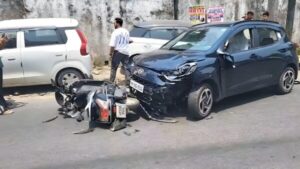Scooty and car after the collision.