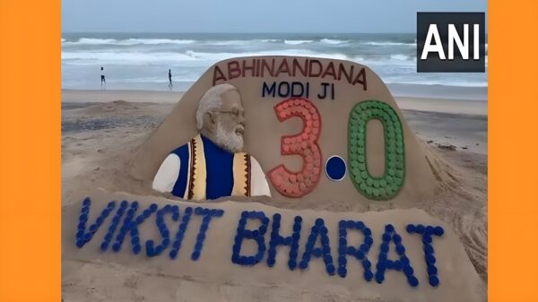 IMAGE: Sand artist Sudarshan Patnaik created this sand art for prime ministerial candidate Narendra Modi at Puri beach ahead of the swearing-in ceremony on Sunday. Photograph: ANI photo