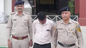 Accused secretary with the police team