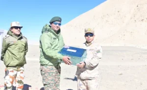 Indian and Chinese soldiers exchange Diwali sweets after withdrawal of troops at border