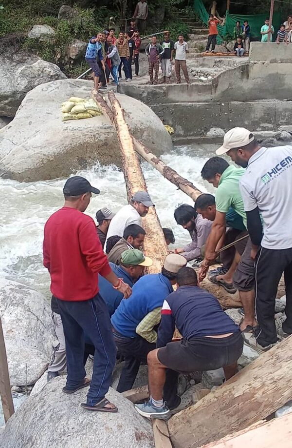 Villagers Rebuild Wooden Bridge Over Tirthan River for the Third Time