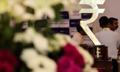 Rupee cracks below 90 to the dollar, hit by tariffs, capital outflows