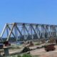 Inspection of Chakki bridge raises hope for early resumption of service The inspection of the newly built railway bridge over the Chakki rivulet at Kandwal in Nurpur by the General Manager, Northern Railways, Jammu, a few days ago has given hope that the suspended train services from the Pathankot railway station may be resumed soon. The railway connectivity was snapped in August 2022 after the old bridge on the Chakki rivulet at Kandwal washed away. The Pathankot-Jogindernagar narrow gauge railway line is considered the life line of people living in distant rural areas of Kangra district where bus service is scanty and commuters are dependent on train service. Ashok Verma, General Manager, Northern Railways, had on January 12inspected this interstate railway bridge along with the main railway stations on the Nurpur road, Talara and Jawalamukhi on the narrow-gauge section known as Kangra Valley Railways. Besides, Verma also reviewed the safety standards, evaluated amenities for passengers and the possibility of the modernisation of this historical route. The General Manager also thoroughly inspected the railway tracks, bridges and signal systems falling on the narrow-gauge section. Verma, while inspecting the Chakki bridge, directed the Railway officials to complete the ongoing finishing work so that it could be opened for the restoration of train services from the main Pathankot railway station. He also laid emphasis on checking the strength and safety of the narrow-gauge railway tracks, especially in hilly areas. As per Northern Railways sources, this bridge having a length of 560 metres and comprising six piers and two abutments had been built at a cost of Rs 78 crore. Earlier, the Northern Railways had expected that it would be opened for the resumption of train services at November end last year but was deferred due to the incomplete construction of pathways, inspection stairs and other protection work. Before the old Chakki railway bridge washed away in 2022, seven (up-down) passenger trains were running on this narrow-gauge line every day, serving hundreds of passengers of Kangra district. However, after the bridge was partially restored, only two trains (up-down) ran between Nurpur and the Baijnath railway station. The partially-restored train services remain suspended for around five months from July to November every year due to landslides from fragile hills falling on railway tracks at different locations near Kangra. The condition of the rail track between Pathankot and Jogindernagar has worsened in the past one decade. Railway services remained suspended for around five months every year after landslide debris fell on tracks during the monsoon season. This year, too, the train services were suspended on July 4 and had not been restored till now, causing a lot of resentment among commuters. The Kangra valley railway line is considered the lifeline of 40 lakh residents of the lower hills of Himachal Pradesh. The train services are very important for commuters and they want a permanent solution to the problem of landslides blocking the railway tracks.
