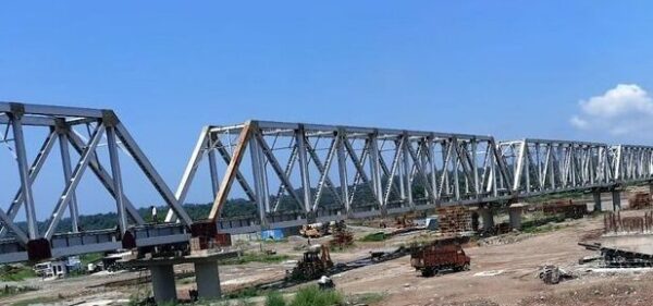 Inspection of Chakki bridge raises hope for early resumption of service The inspection of the newly built railway bridge over the Chakki rivulet at Kandwal in Nurpur by the General Manager, Northern Railways, Jammu, a few days ago has given hope that the suspended train services from the Pathankot railway station may be resumed soon. The railway connectivity was snapped in August 2022 after the old bridge on the Chakki rivulet at Kandwal washed away. The Pathankot-Jogindernagar narrow gauge railway line is considered the life line of people living in distant rural areas of Kangra district where bus service is scanty and commuters are dependent on train service. Ashok Verma, General Manager, Northern Railways, had on January 12inspected this interstate railway bridge along with the main railway stations on the Nurpur road, Talara and Jawalamukhi on the narrow-gauge section known as Kangra Valley Railways. Besides, Verma also reviewed the safety standards, evaluated amenities for passengers and the possibility of the modernisation of this historical route. The General Manager also thoroughly inspected the railway tracks, bridges and signal systems falling on the narrow-gauge section. Verma, while inspecting the Chakki bridge, directed the Railway officials to complete the ongoing finishing work so that it could be opened for the restoration of train services from the main Pathankot railway station. He also laid emphasis on checking the strength and safety of the narrow-gauge railway tracks, especially in hilly areas. As per Northern Railways sources, this bridge having a length of 560 metres and comprising six piers and two abutments had been built at a cost of Rs 78 crore. Earlier, the Northern Railways had expected that it would be opened for the resumption of train services at November end last year but was deferred due to the incomplete construction of pathways, inspection stairs and other protection work. Before the old Chakki railway bridge washed away in 2022, seven (up-down) passenger trains were running on this narrow-gauge line every day, serving hundreds of passengers of Kangra district. However, after the bridge was partially restored, only two trains (up-down) ran between Nurpur and the Baijnath railway station. The partially-restored train services remain suspended for around five months from July to November every year due to landslides from fragile hills falling on railway tracks at different locations near Kangra. The condition of the rail track between Pathankot and Jogindernagar has worsened in the past one decade. Railway services remained suspended for around five months every year after landslide debris fell on tracks during the monsoon season. This year, too, the train services were suspended on July 4 and had not been restored till now, causing a lot of resentment among commuters. The Kangra valley railway line is considered the lifeline of 40 lakh residents of the lower hills of Himachal Pradesh. The train services are very important for commuters and they want a permanent solution to the problem of landslides blocking the railway tracks.